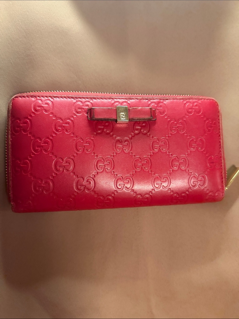Gucci Embossed GG Zip-Around Wallet Bow Accent